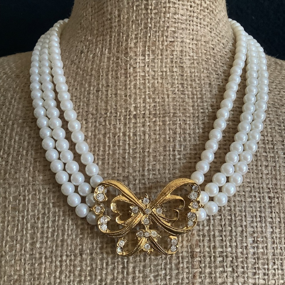 Avon Nina Ricci buttery three strand faux pearl & rhinestone necklace.